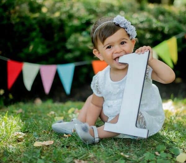 Cute, One-year-old Smiling Baby Girl Outdoors. She Poses Among The Trees.  Stock Photo, Picture and Royalty Free Image. Image 43875265.